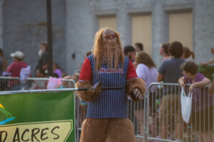 A man in a sasquatch costume and a Mid-Atlantic team jersey